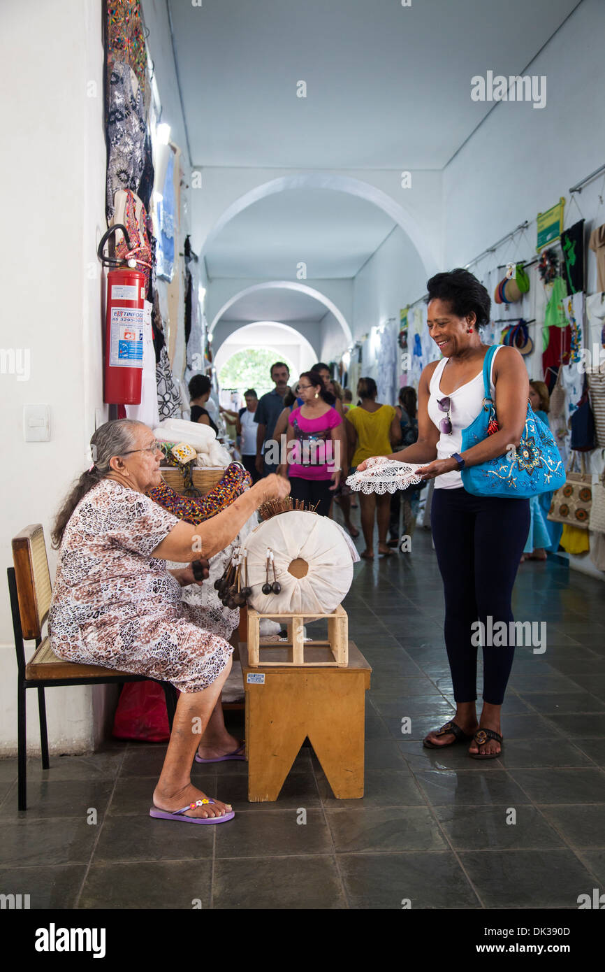 Woman making lace in a traditional way at Centro de Turismo do Ceara, Fortaleza, Brazil. Stock Photo