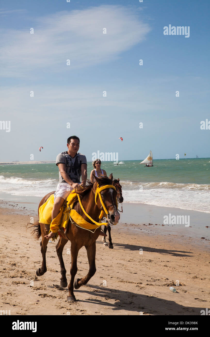 Horse riding on the beach, Cumbuco, Fortaleza district, Brazil. Stock Photo