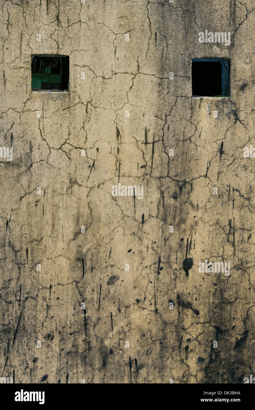 Vietnam, Hoi An, grunge, plaster, wall, two small windows Stock Photo