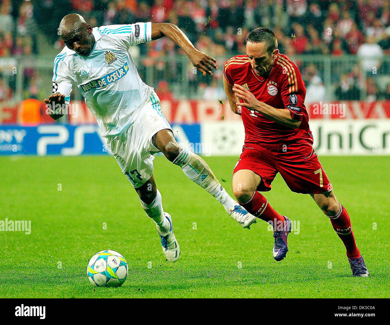 Franck Ribéry of team Bayern battles against Marsielle's Stephane Mbia in a UEFA Quarter finals game between Bayern and Stock Photo