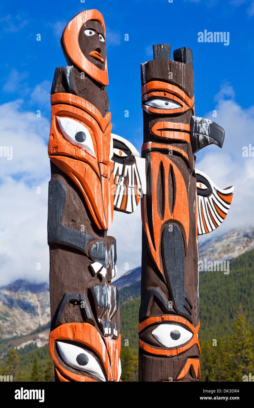 Traditional canadian native Totem poles at  Sunwapta Falls resort Jasper National Park  rockies Alberta Canada Stock Photo