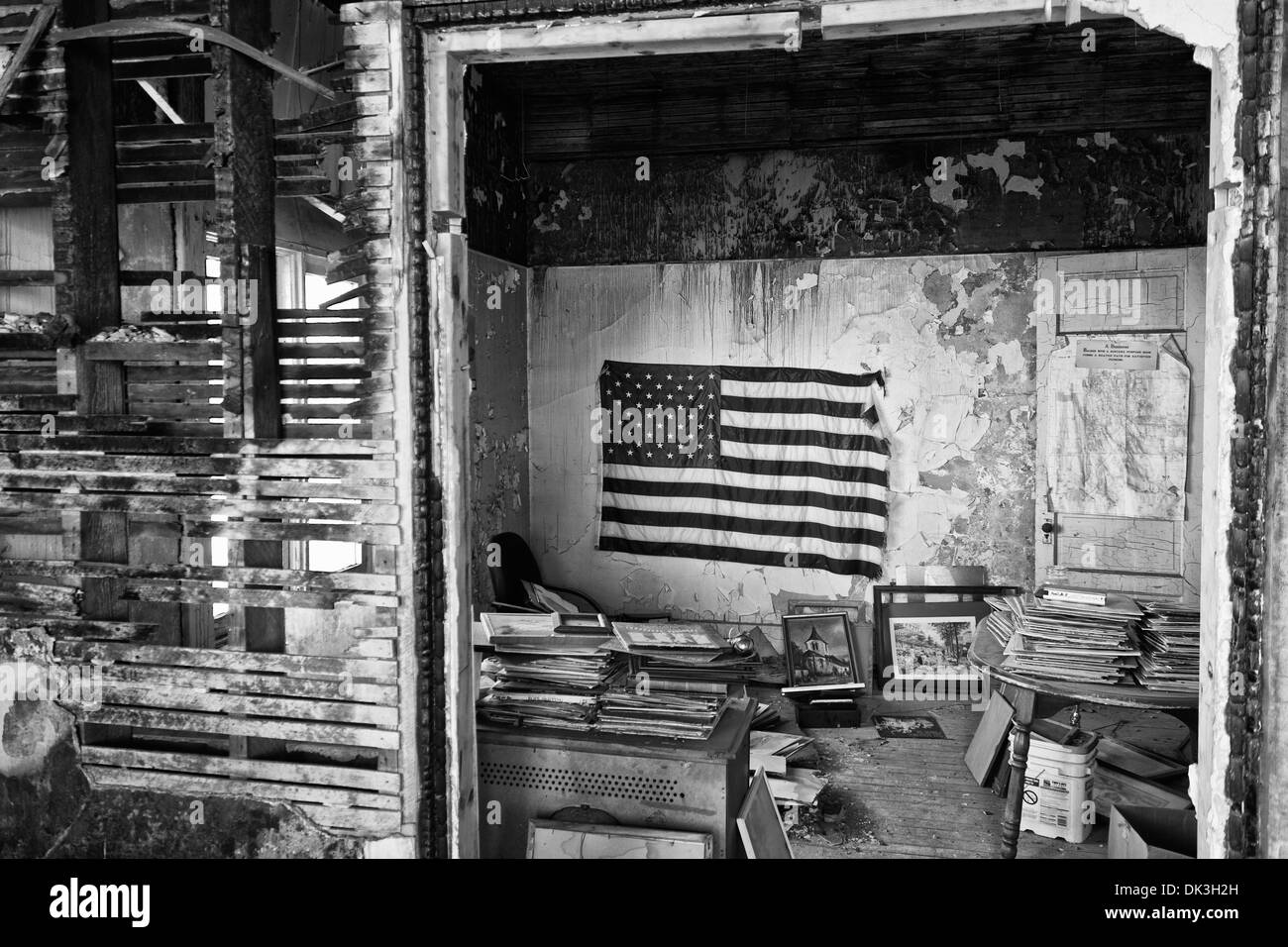 US Flag in an Abandoned Building Wide - US Flag Above the Trash in an Abandoned Apartment Slum Stock Photo