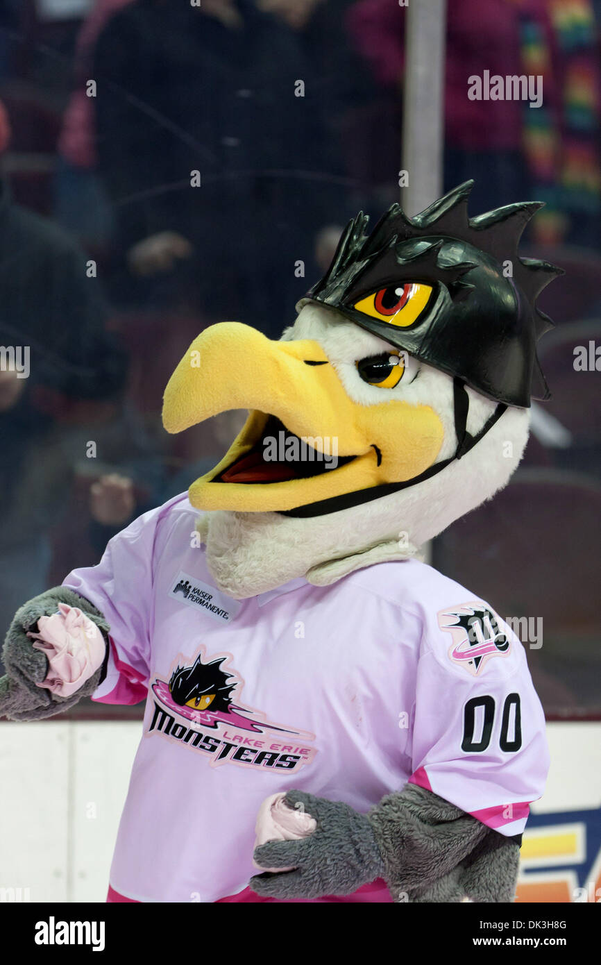 Mar. 4, 2011 - Cleveland, Ohio, U.S - Lake Erie Monsters mascot Sully with  t-shirts to throw to the fans during the second intermission. The Lake Erie  Monsters defeated the Rockford Icehogs