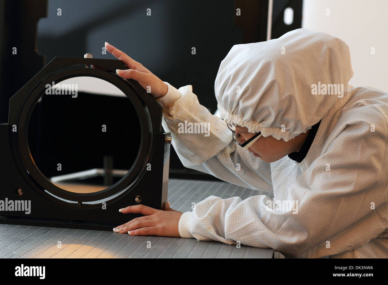 a Scientist woman works in optical lab Stock Photo