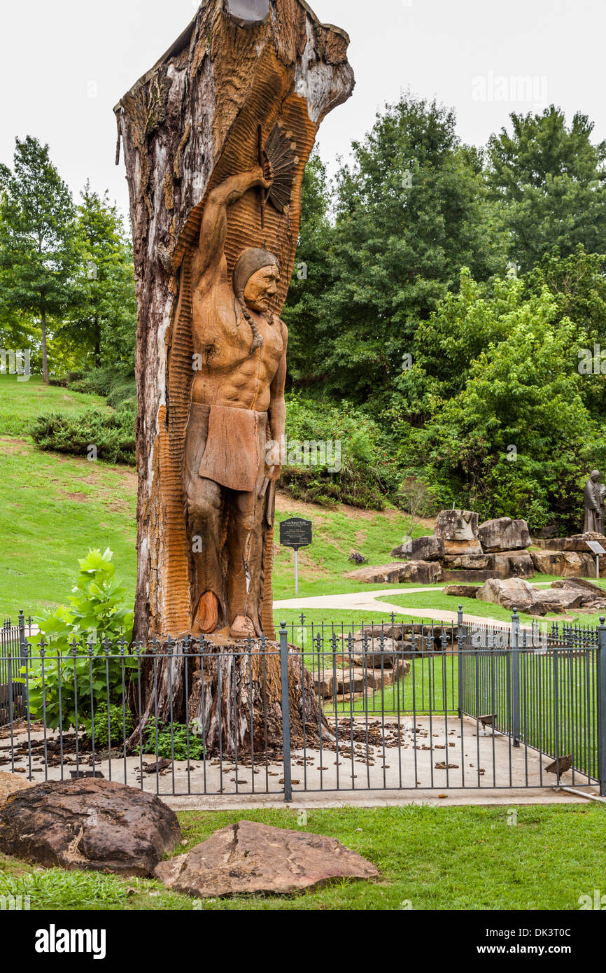 Statue of Chief Tuscumbia carved into tree at Spring Park in Stock