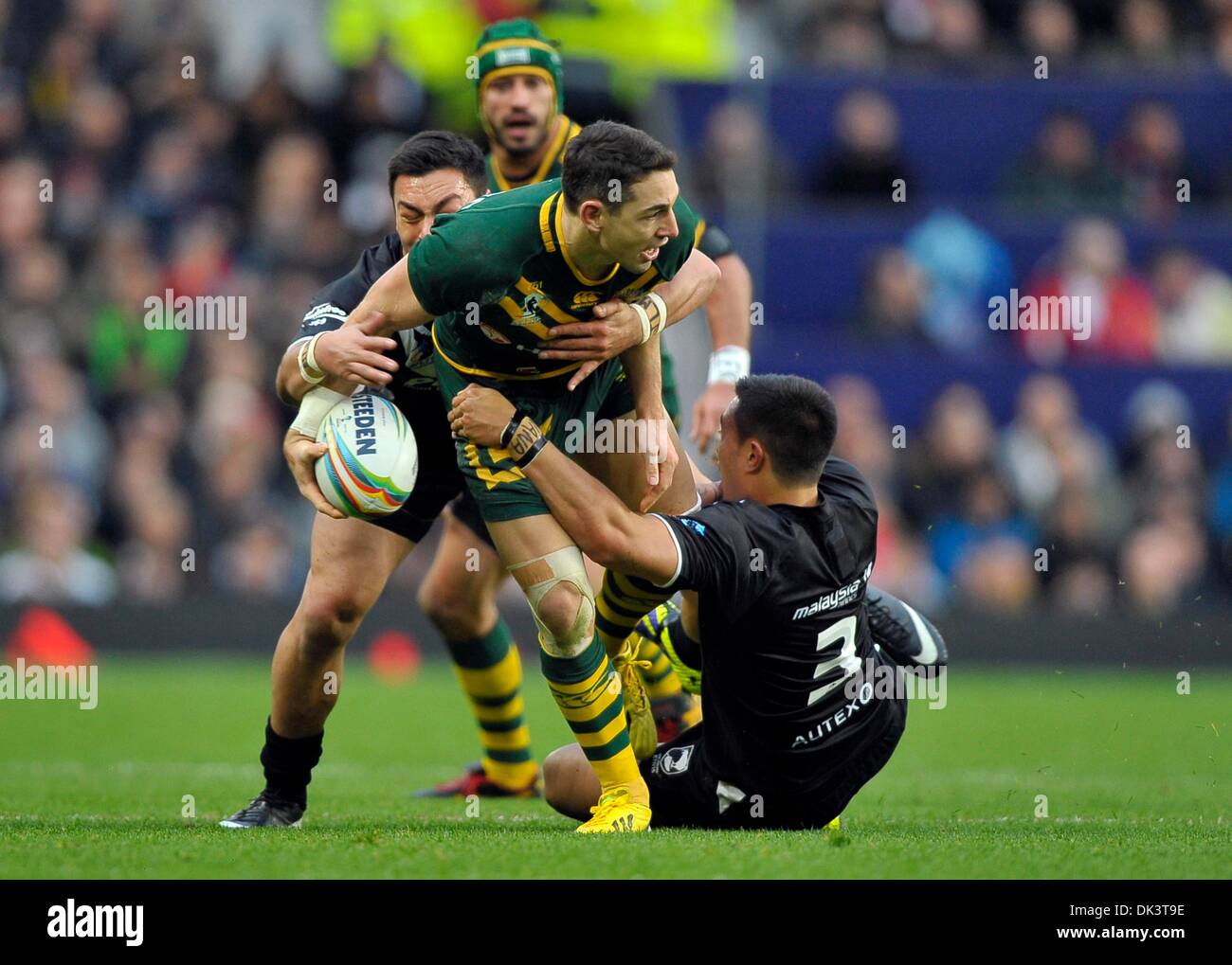 Manchester, UK. 1st Dec, 2013. Billy Slater (Australia) is tackled by Dean Whare (New Zealand, right) and Alex Glenn (New Zealand) - New Zealand v Australia - Rugby League World Cup Final - Old Trafford - Manchester - UK. Credit:  Sport In Pictures/Alamy Live News Stock Photo