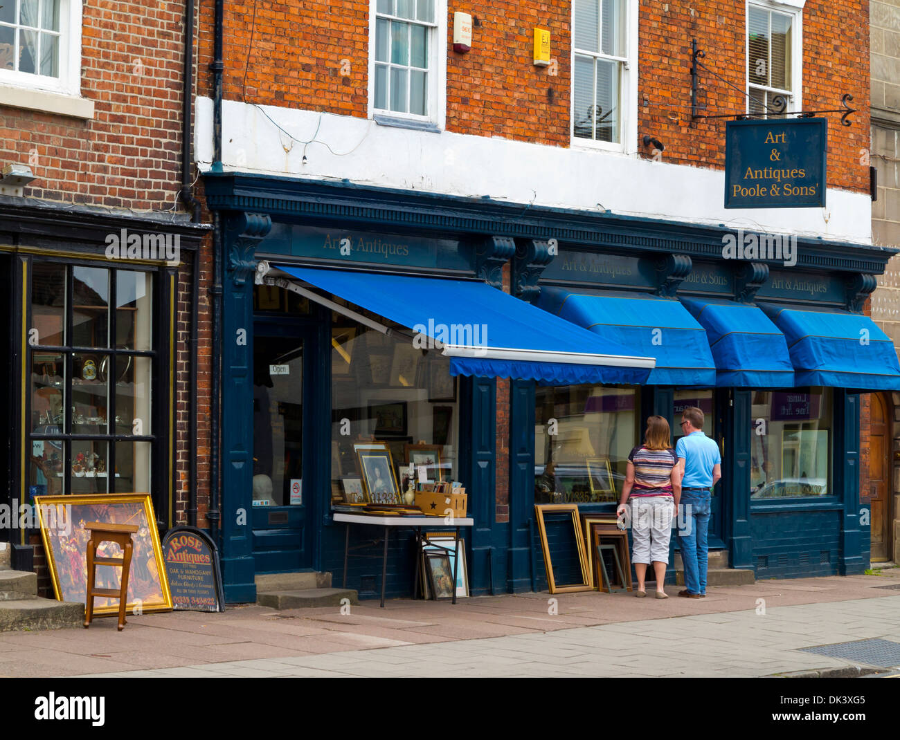 Ashbourne Shops Couple looking in window of an antiques shop in Ashbourne Derbyshire ...