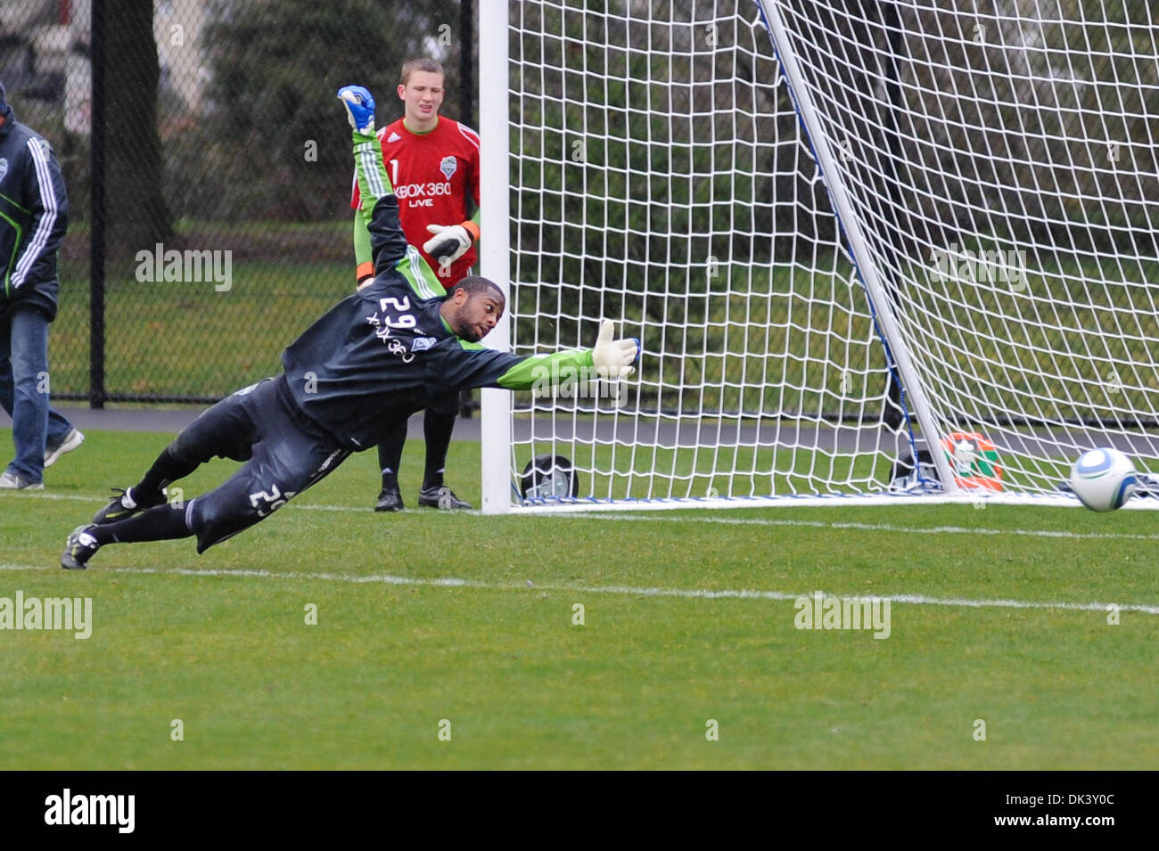 March 12, 2011 - Tukwila, Washington, United States of America - Seattle Sounders FC Goal Keeper, Josh Ford dives in an attempt to save a shot on goal at Sounders training. (Credit Image: © Chris Coulter/Southcreek Global/ZUMApress.com) Stock Photo