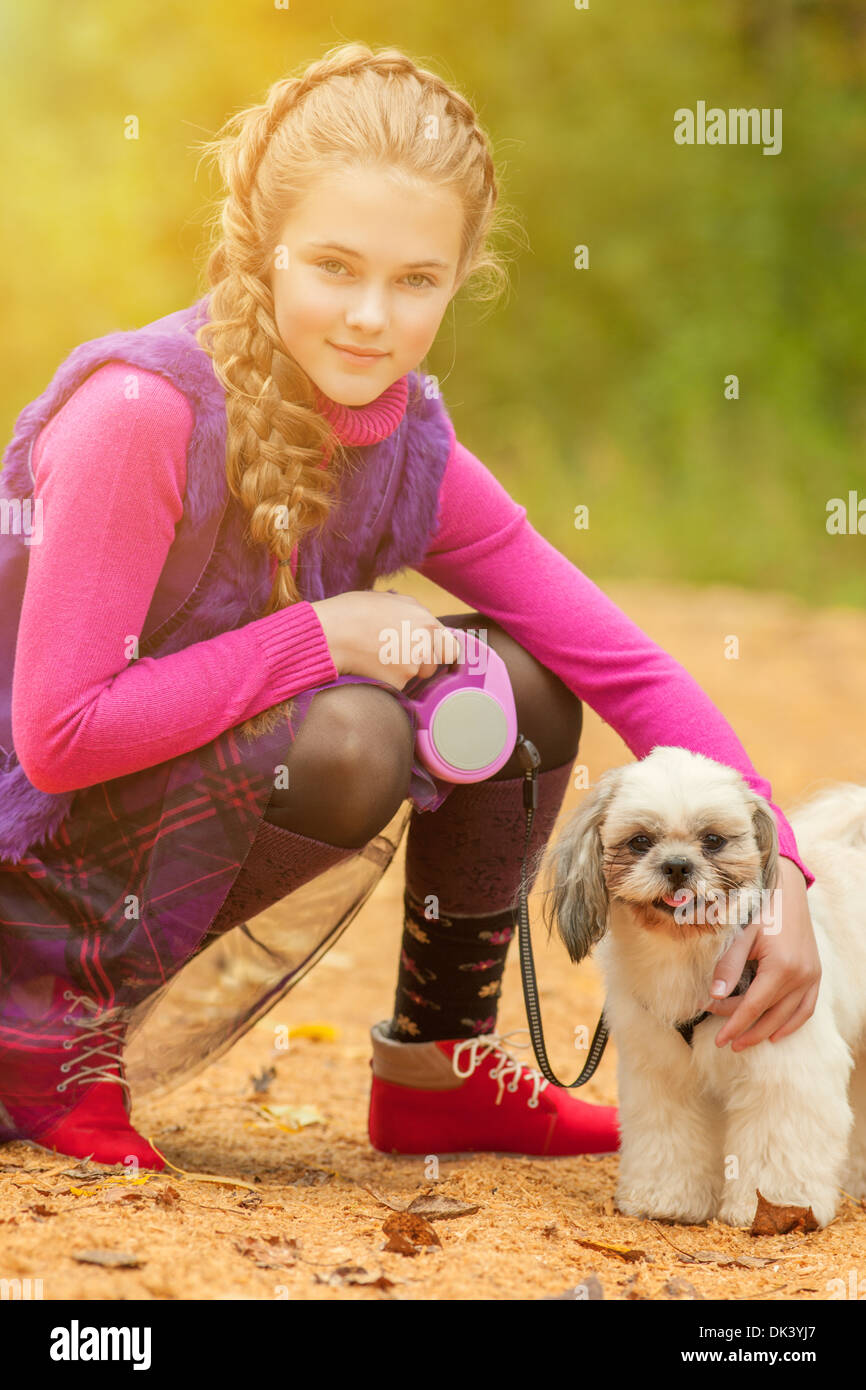 Portrait of adorable little girl posing with dog Stock Photo - Alamy