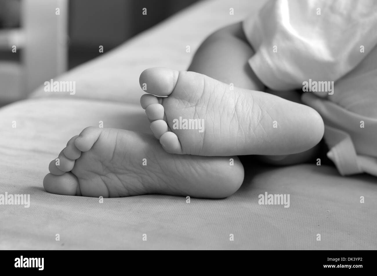 Feet toes sleeping child little Black and White Stock Photos & Images ...