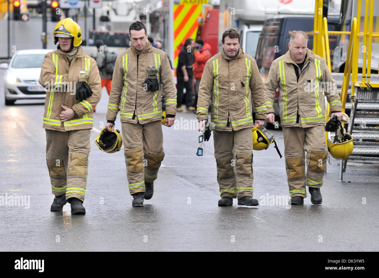 Fire men leaving the scene of the Clutha pub helicopter crash during the rescue operation. On Friday the 29th of November a helicopter crashed in to the Clutha Vaults bat in Glasgow on Stockwells Street. 9 people have been confirmed dead and several people have been taken to the hospital. Stock Photo