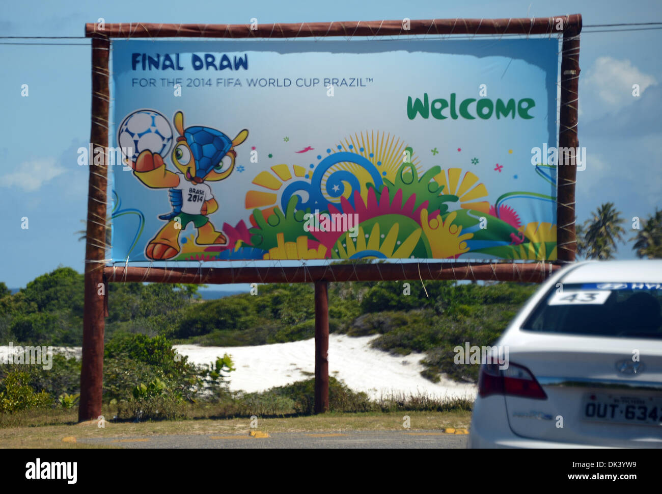 Costa do Sauipe, Brazil. 02nd Dec, 2013. A sign advertising the final draw for the 2014 FIFA world cup Brazil stands at the roadside in Costa do Sauipe, Brazil, 02 December 2013. The final draw for the preliminary round groups of the 2014 FIFA world cup Brazil will be held on 06 December 2013. Photo: MARCUS BRANDT/dpa/Alamy Live News Stock Photo