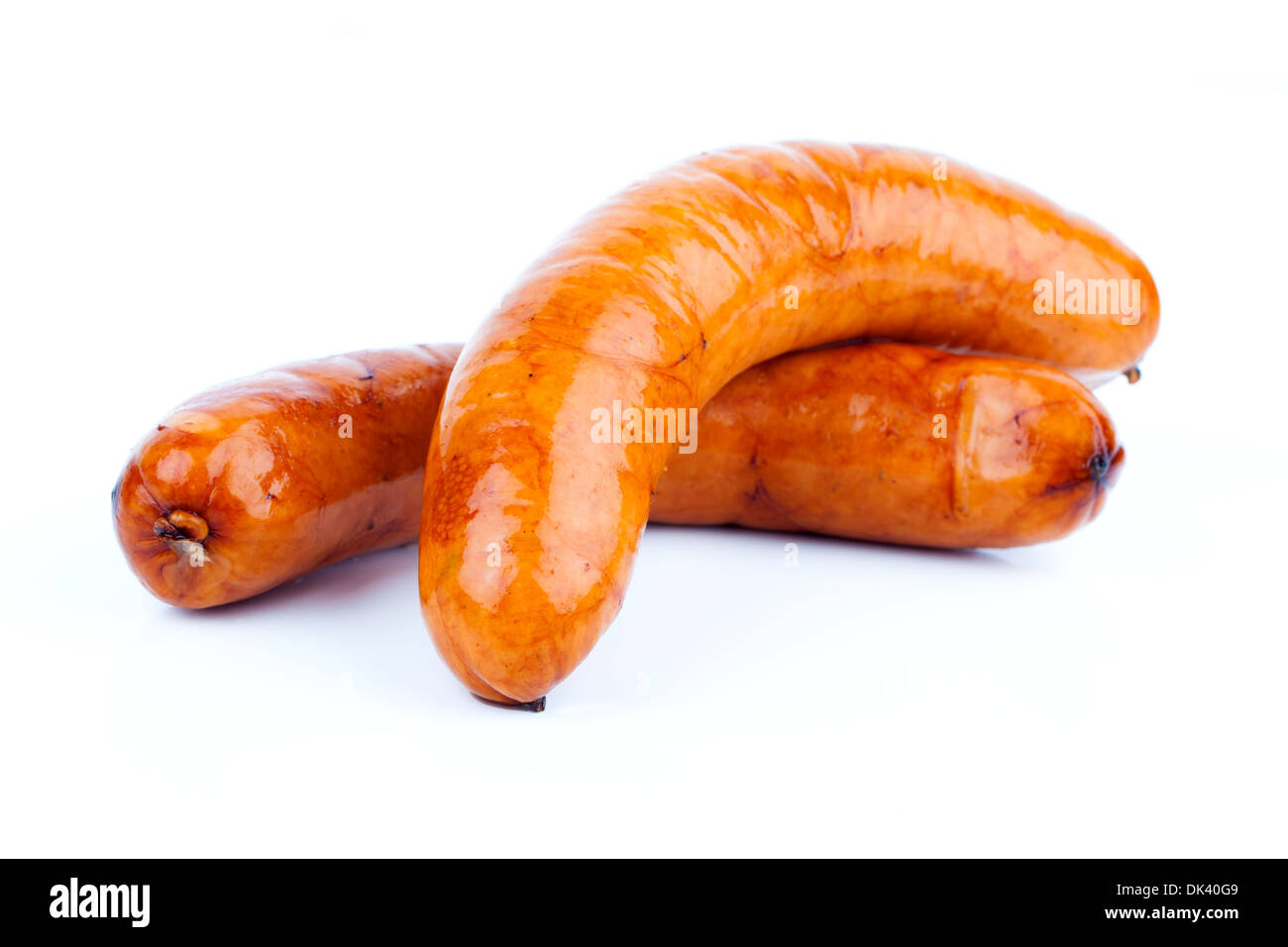 Stack of cooked sausages, on a white background Stock Photo