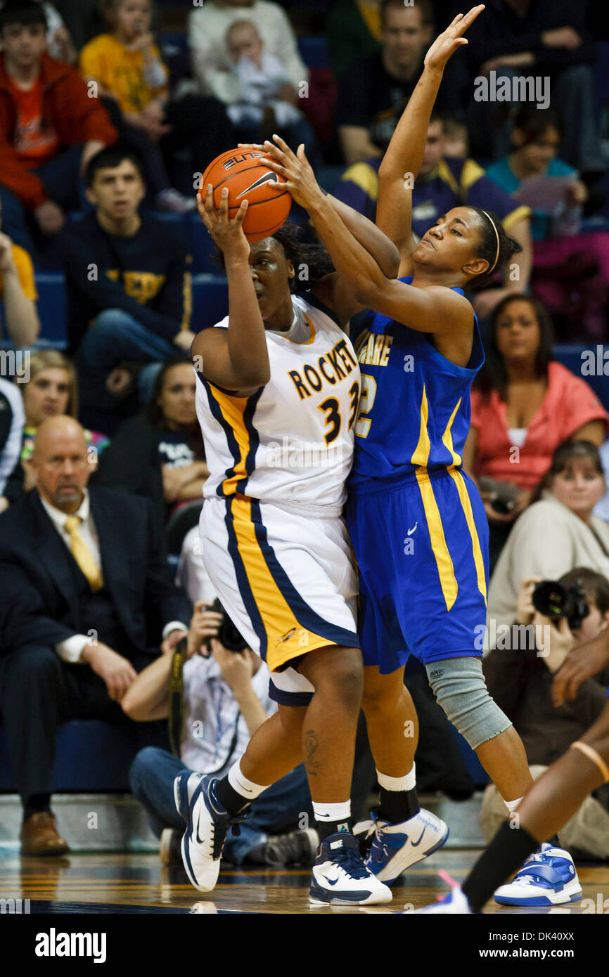 Mar. 16, 2011 - Toledo, Ohio, U.S - Toledo center Yolanda Richardson (#33) is closely guarded by Delaware forward Danielle Parker (#12) during second-half game action.  The Toledo Rockets, of the Mid-American Conference, defeated the Delaware Blue Hens, of the Colonial Athletic Association, 58-55 in the first round game of the 2011 Women's National Invitational Tournament being pla Stock Photo