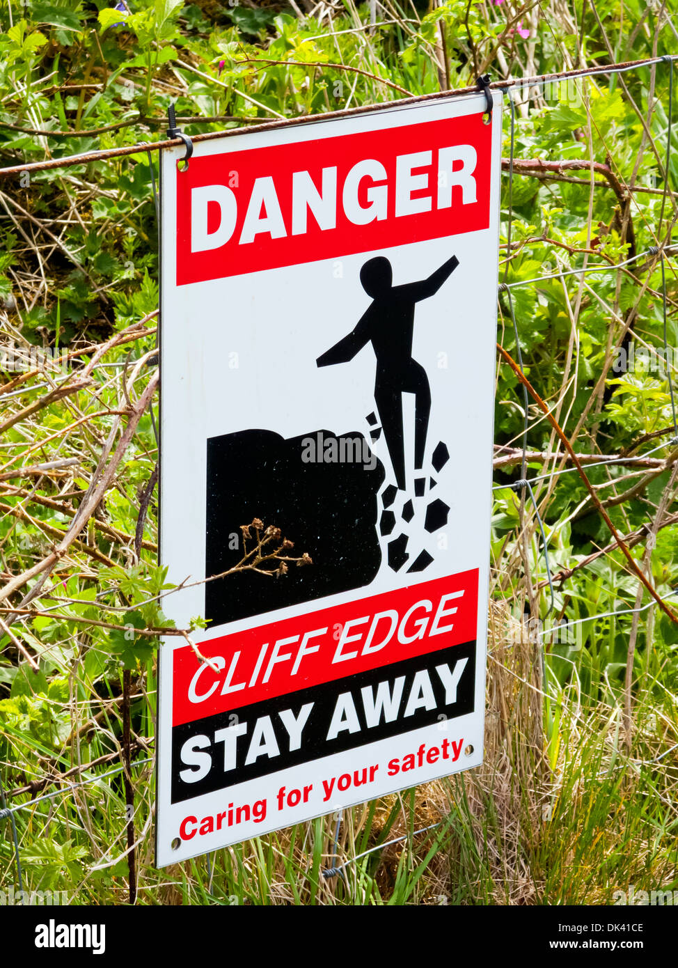 Danger Cliff Edge Stay Away sign outside a quarry in the Peak District Derbyshire England UK Stock Photo