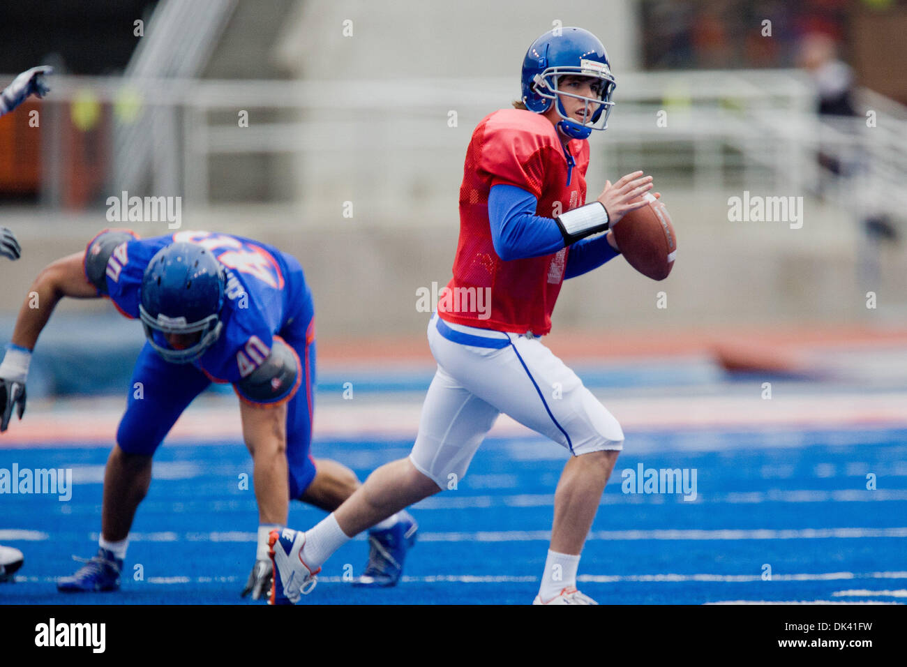 Mar. 16, 2011 - Boise, Idaho, U.S - Boise State Broncos QB Kellen Moore (11) rolls out to pass during the annual Boise State Blue and Orange spring game in Bronco Stadium. (Credit Image: © Stanley Brewster/Southcreek Global/ZUMAPRESS.com) Stock Photo