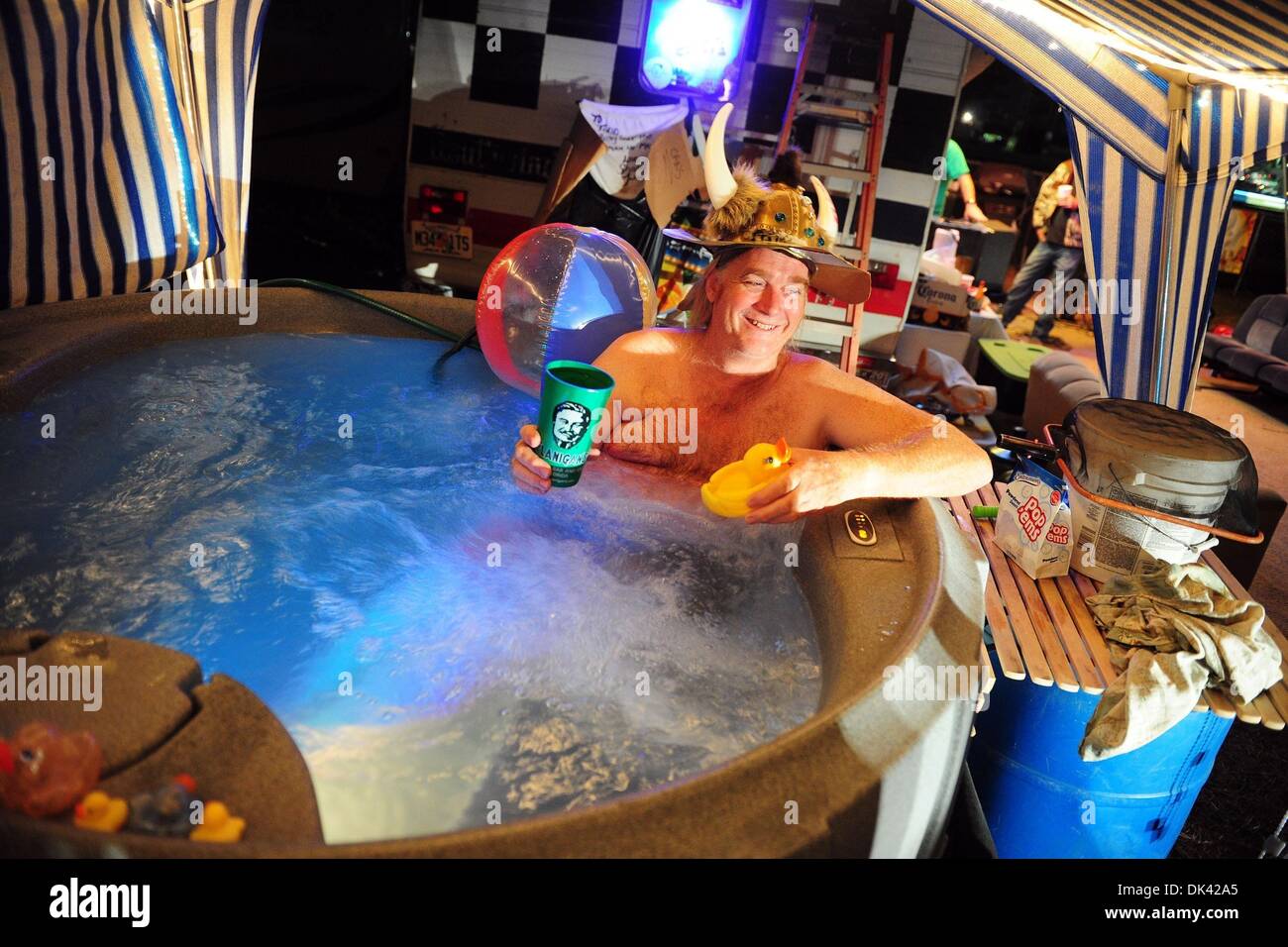 Mar 18, 2011 - Sebring, Florida, U.S. - SHAUN SCOTT, of West Palm Beach, Florida, wears a viking hat while he enjoys his jacuzzi in the infield during night practice for the 12 Hours of Sebring. (Credit Image: © Rainier Ehrhardt/ZUMA Press/Rainier Ehrhardt) Stock Photo