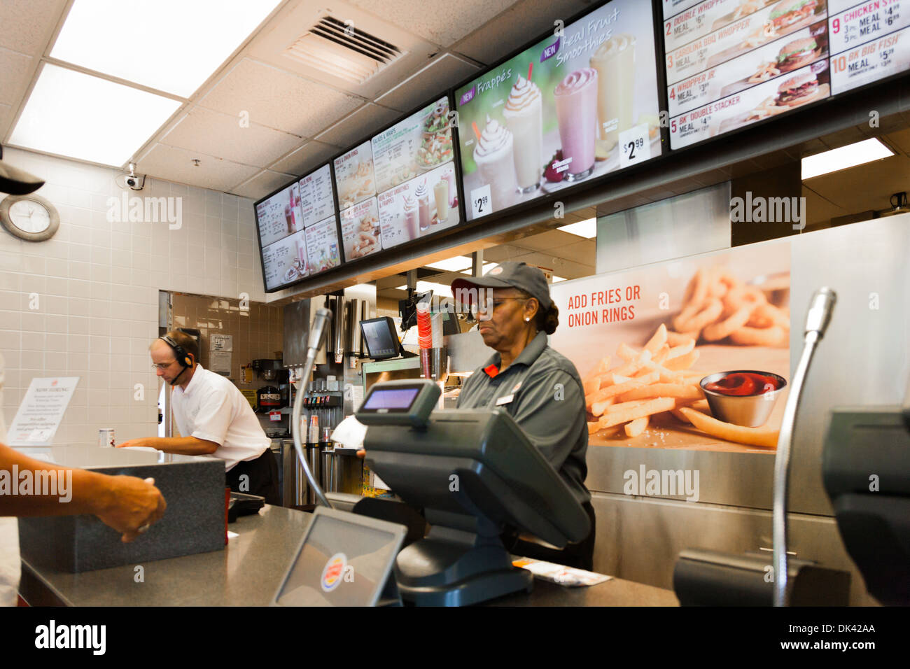Employee taking a fast food order in a Burger King restaurant Stock Photo