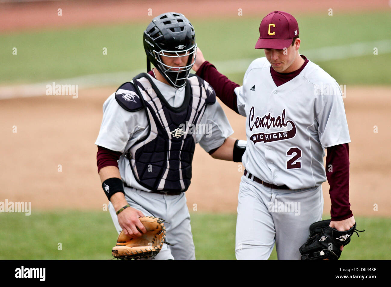 Mar. 19, 2011 - Columbia, Missouri, U.S - CMU catcher Matt Stevens (11) chats with CMU pitcher Reid Rooney (2) during a Div.1 NCAA baseball game between the Missouri Tigers and the Central Michigan University Chippewas in Taylor Stadium at Simmons Field on the campus of the University of Missouri in Columbia Missouri. Missouri defeated Michigan 14-7. (Credit Image: © Scott Kane/Sou Stock Photo