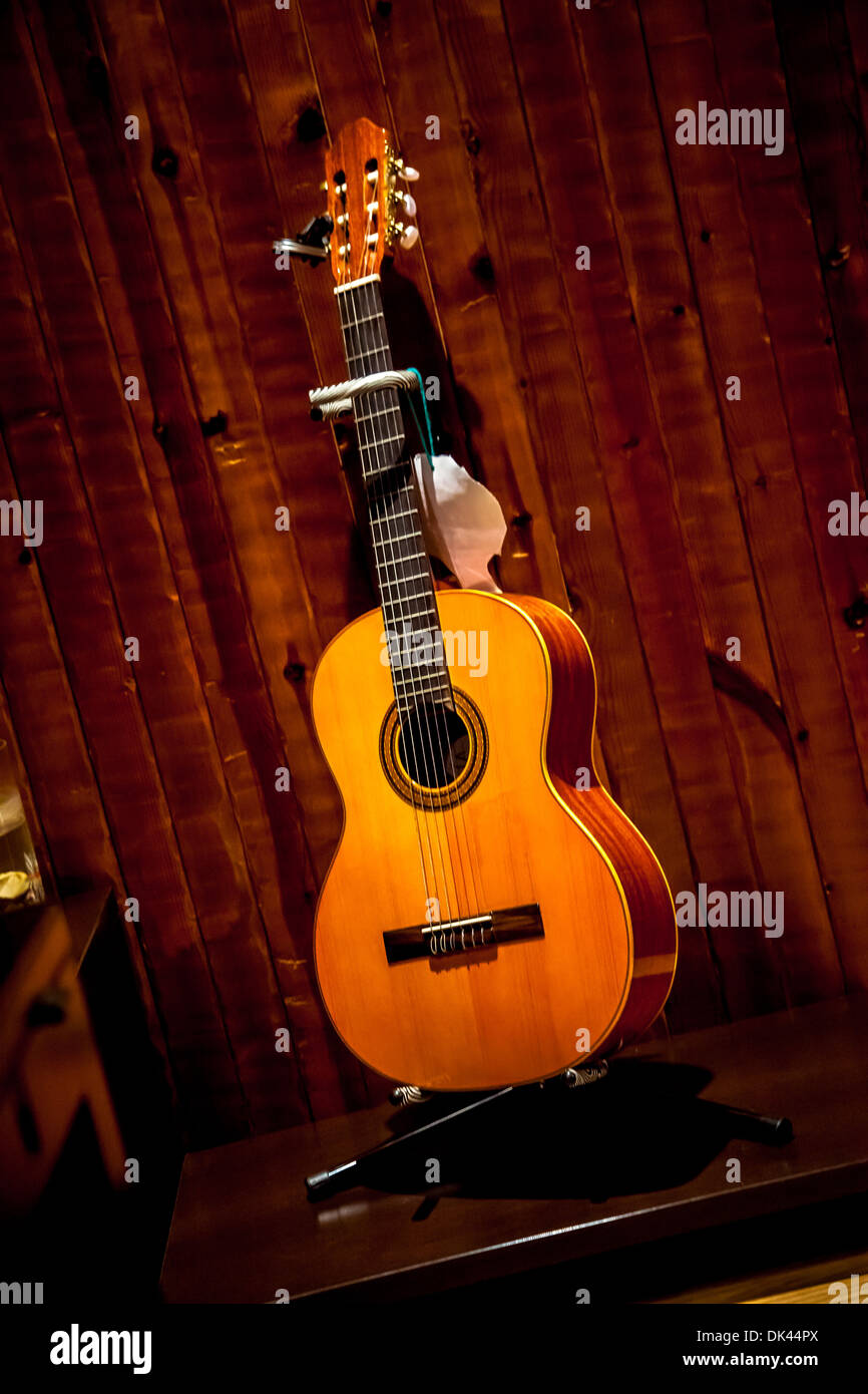 Classic spanish guitar near of a wood wall Stock Photo Alamy