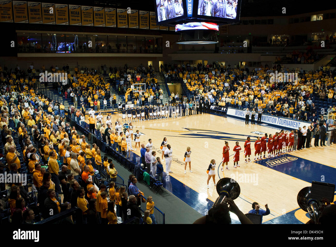 Mar. 22, 2011 - Toledo, Ohio, U.S - Fans, players, and coaches stand as the Toledo Rockets pep band plays the National Anthem prior to the start of the game.  The Toledo Rockets, of the Mid-American Conference, defeated the Alabama Crimson Tide, of the Southeastern Conference, 74-59 in the ''Sweet 16'' third round game of the 2011 Women's National Invitational Tournament played at  Stock Photo