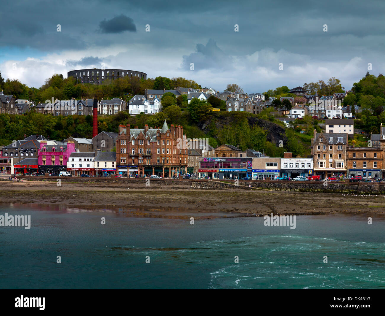 View across the seafront at Oban in Argyll and Bute Scotland UK a resort town with McCaig's Tower visible on the hill above Stock Photo