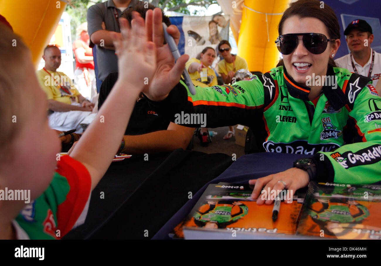 Mar. 25, 2011 - St. Petersburg, Florida - PEYTON NIXON, 4, gets a high five from IndyCar driver DANICA PATRICK during an autograph session in the Indy Fan Zone area on the opening day of the Honda Grand Prix of St. Petersburg Friday. Nixon, from Valrico, was accompanied by his mother, Kelly Nixon. ''Dario's his favorite,'' Nixon said as she explained that red is his favorite color  Stock Photo