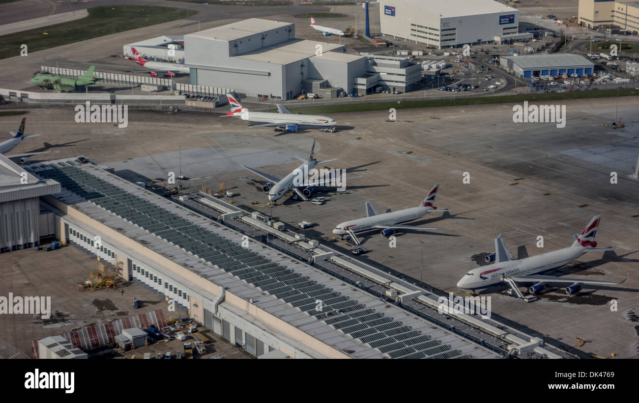 Airplanes parked up outside airport terminal Stock Photo