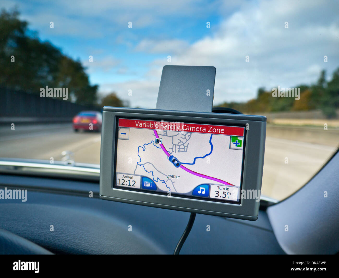 Car Satellite Navigation screen on M25 Orbital motorway with red 'Variable Safety Camera Zone' alert displayed Surrey UK Stock Photo