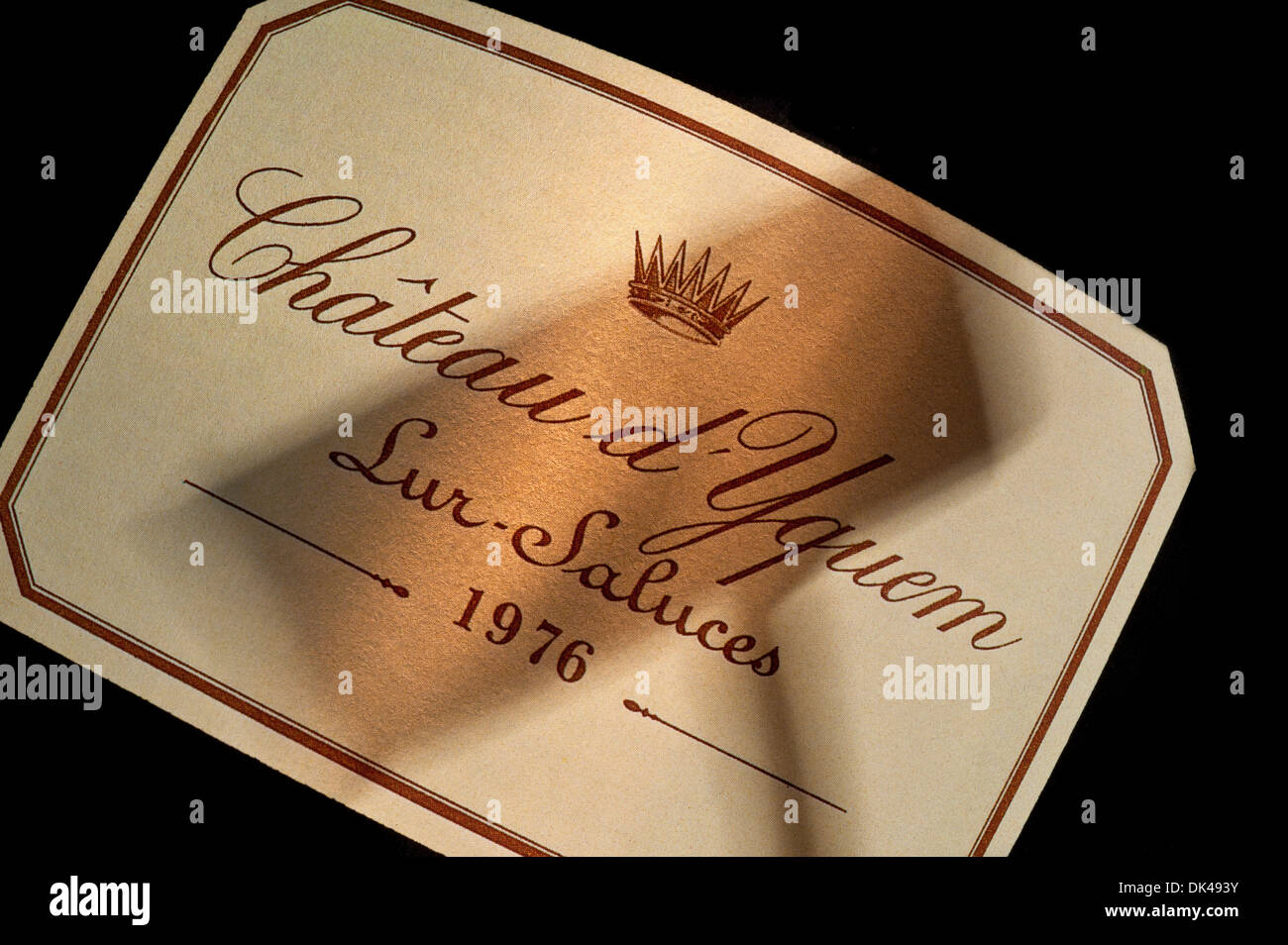 Shadow of auctioneers hammer on 1976 Chateau d'Yquem white wine label French Premier Cru Supérieur Sauternes Bordeaux France Stock Photo