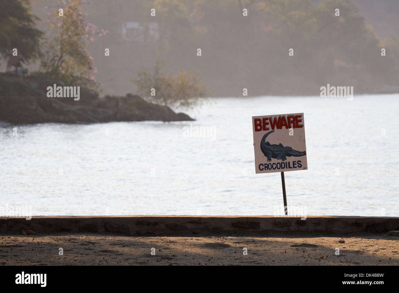 A sign at Lake Kariba, Zambia warns visitors of the dangers of crocodiles Stock Photo