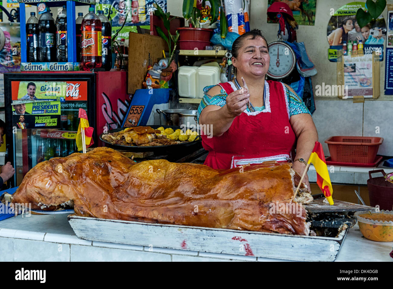 Vendor in the main market of Cuenca Ecuador, selling slices of pork Stock Photo