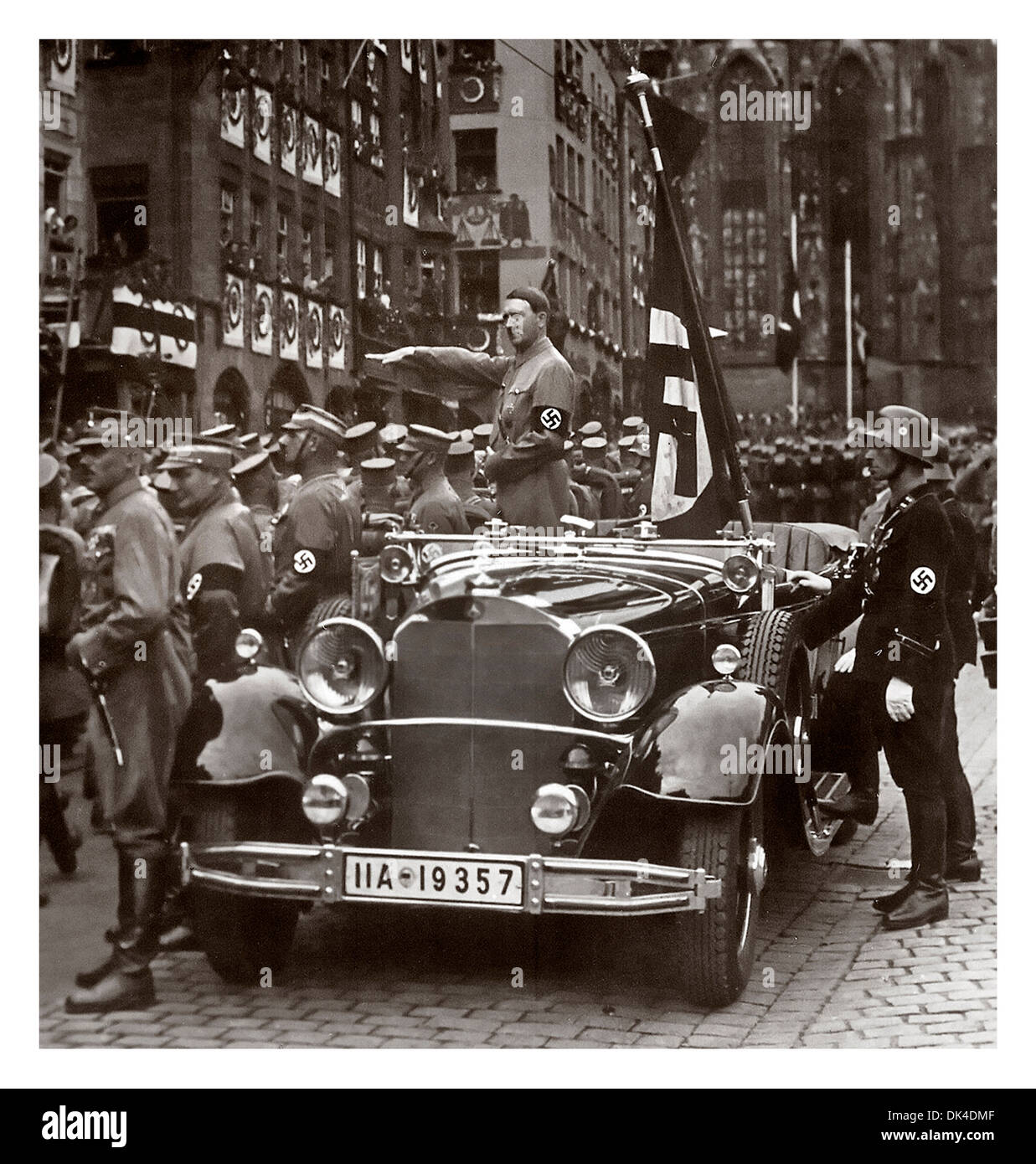 Adolf Hitler in the 1930's taking a parade salute with the Nazi brown shirt army (Sturmabteilung) and the Waffen SS protection squad Stock Photo