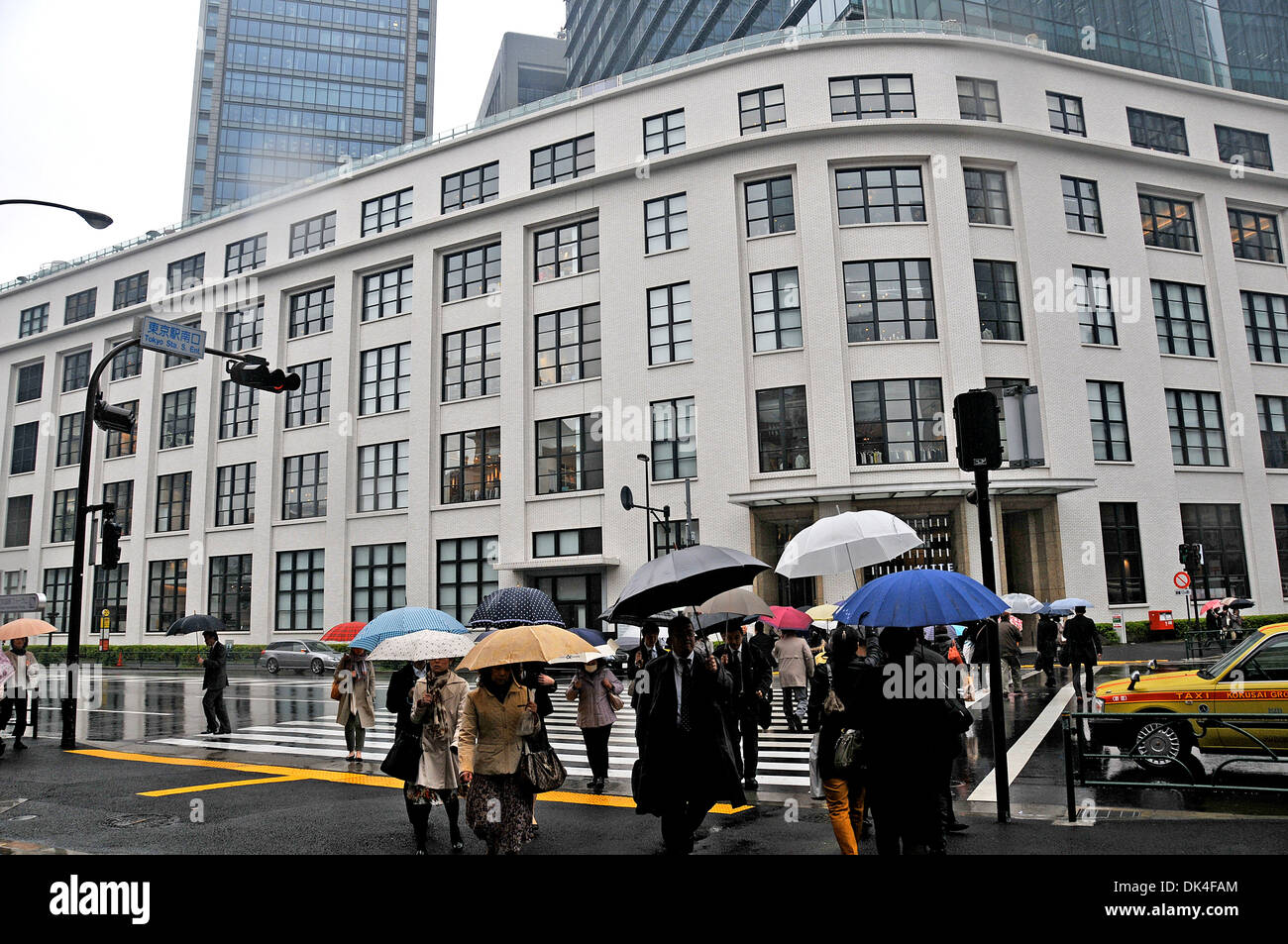 street scene on rainy day Central Tokyo Japan Stock Photo