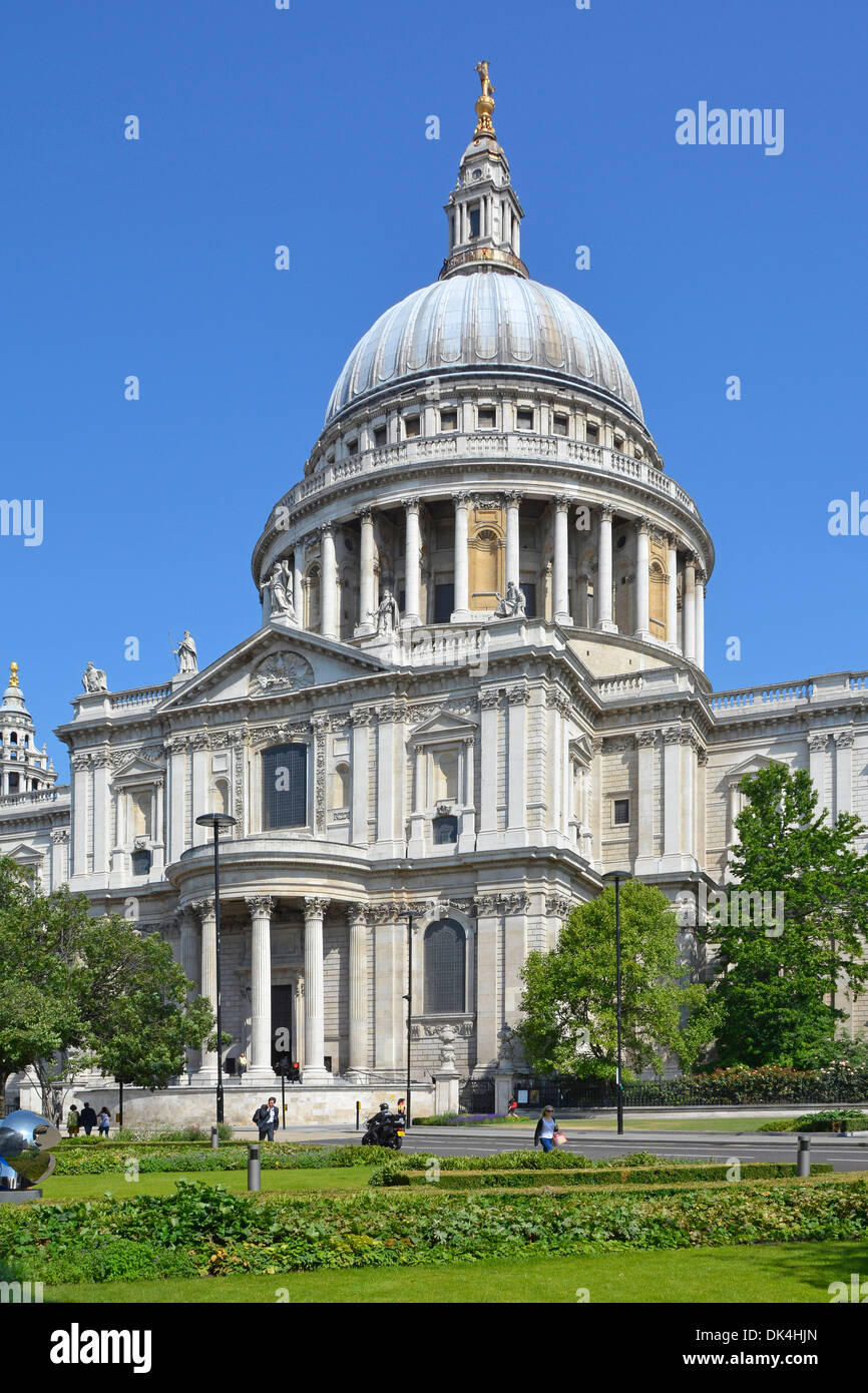 Street scene summer view of Sir Chistopher Wren iconic design of historical St Pauls cathedral & dome with viewing gallery blue sky day City of London Stock Photo