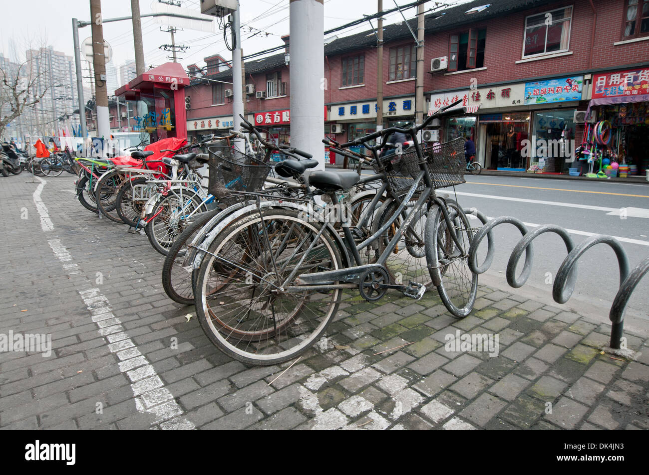 BIcycles on street in Shanghai, China Stock Photo