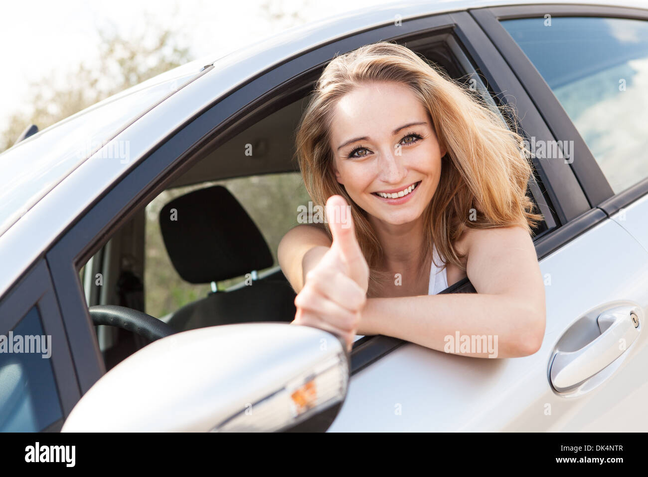 young attractive happy woman sitting in car summer portrait outdoor ...