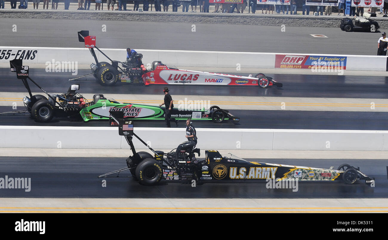 Apr. 17, 2011 - Concord, North Carolina, United States of America - Top fuel dragster drivers Tony Schumacher, Steve Torrence, and Shawn Langdon prepare for their semi-final runs during the VisitMyrtleBeach.com NHRA Four-Wide Nationals Finals at zMax Dragway, Concord, NC. (Credit Image: © David Friend/Southcreek Global/ZUMAPRESS.com) Stock Photo