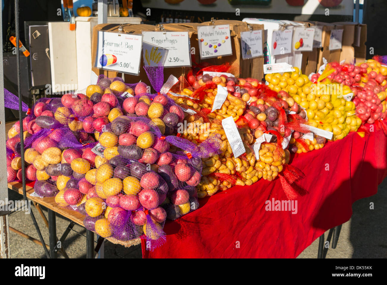 Different kinds of colorful, fresh and delicious looking potatoes at a local farmers market in California, USA Stock Photo