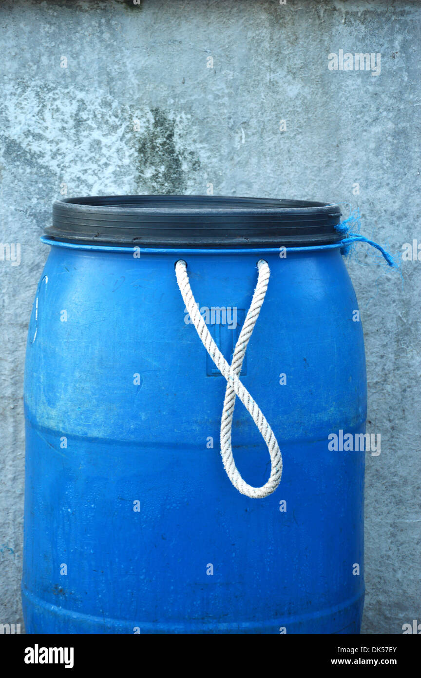 blue plastic barrel with white rope Stock Photo Alamy