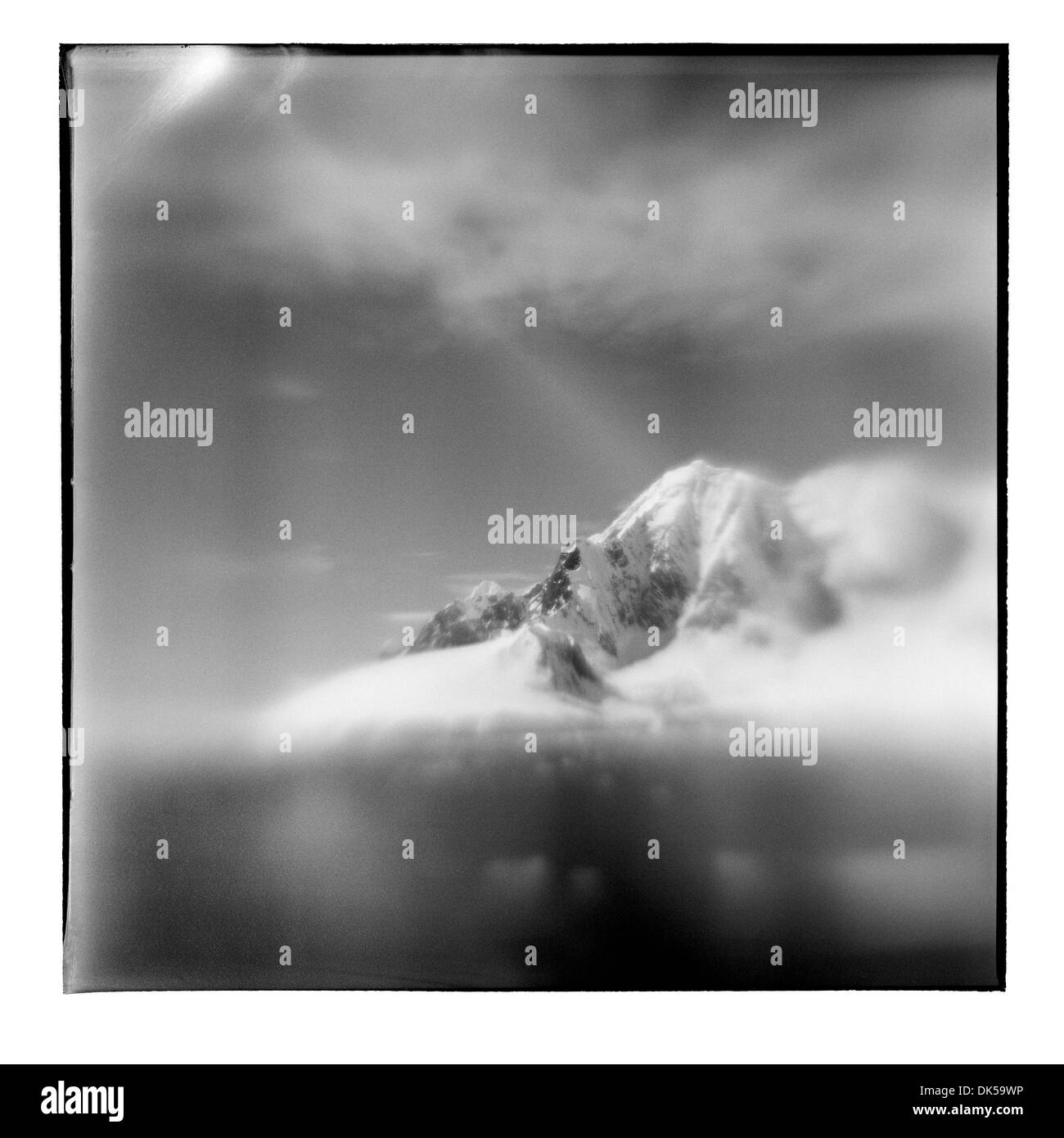 Antarctica, Blurred black and white image of mountain peaks along Lemaire Channel on sunny summer afternoon Stock Photo