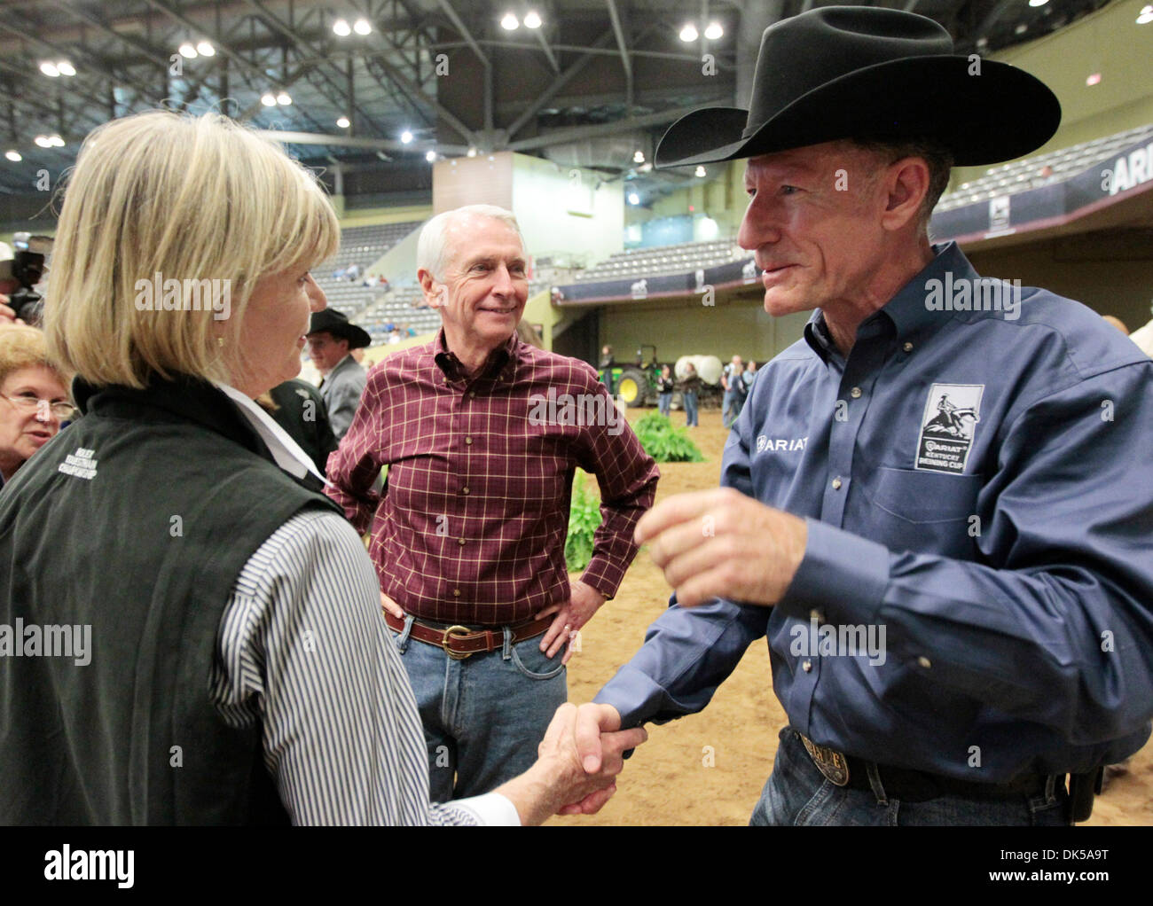 April 29, 2011 - Lexington, Ky., US - Lyle Lovett , right, greeted First Lady Jane Beshear, left and Governor Steve Beshear, center  after he rode Smart and Shiney in the CRI5-star Ariat Kentucky Reining Cup at Alltech Arena during the Rolex Kentucky Three-Day Event at the The Kentucky Horse Park in Lexington, Ky., on Friday April 29, 2011.  Photo by Pablo Alcala | Staff (Credit Im Stock Photo