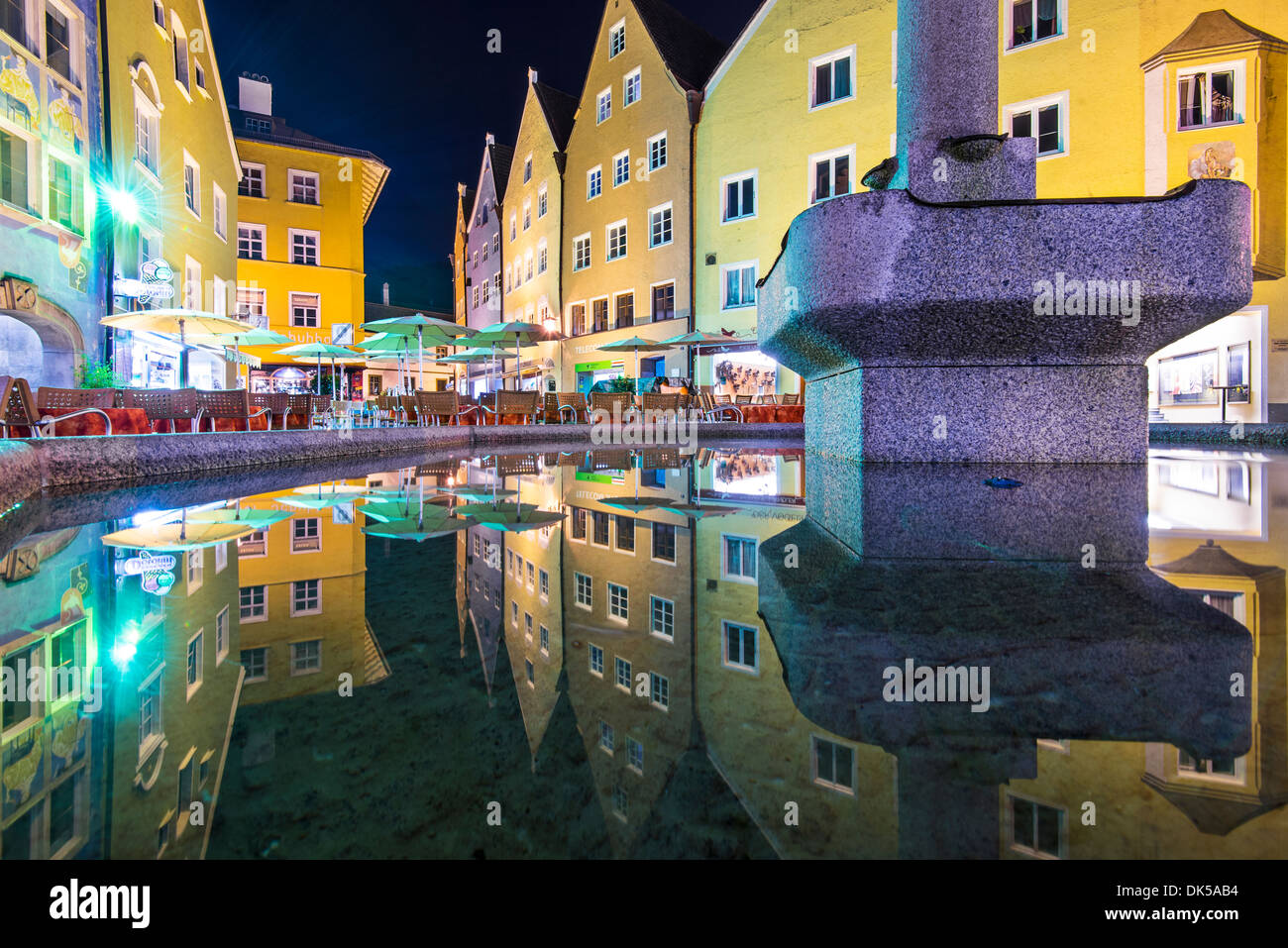 Fussen, Germany old town square and fountain reflections. Stock Photo