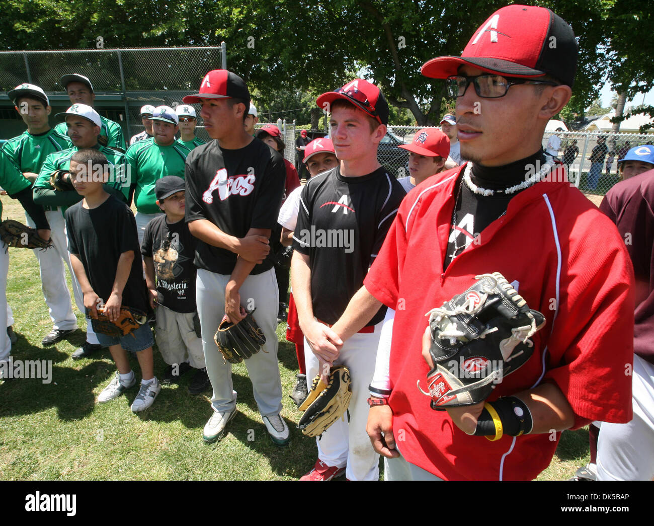 April 30, 2011 - Fresno, California, U.S. - JOHN WALKER/THE FRESNO BEE.Fernando Gutierrez from Tranquility, right, and other baseball players listen to Thomari Story-Harden during the Centeral Valley RBI (Reviving Baseball in Inner Cities) clinic Saturday, April 30, 2011, at Roosevelt High. Major League baseball created RBI as a way to draw more minorities into the sport. This more Stock Photo