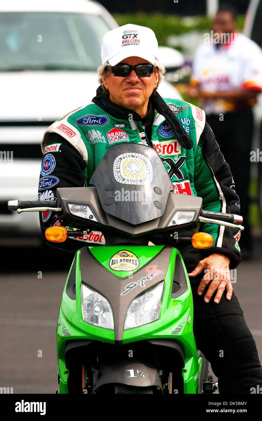 April 30, 2011 - Baytown, Texas, U.S - Funny Car driver John Force (1) starting line watching the race from his motor scooter during the O'Reilly Autoparts Spring Nationals in the Royal Purple Raceway Park in Baytown, TX. (Credit Image: © Juan DeLeon/Southcreek Global/ZUMAPRESS.com) Stock Photo