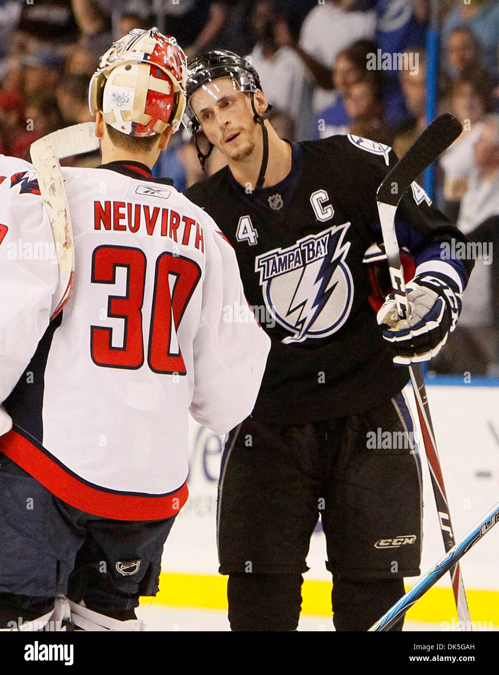 May 4, 2011 - Tampa, FL - DIRK SHADD   |  Times .SP 337940 SHAD LIGHTNING 29 (05/04/11 TAMPA, FL) Tampa Bay Lightning Vinny Lecavalier (4) shakes hands with Washington Capitals goalie Michael Neuvirth (30) at the end of a Lightning 5 to 3 victory in game 4 of the Eastern Conference Semifinals at the St. Pete Times Forum in Tampa Wednesday evening (5/04/11).[DIRK SHADD, Times] (Cred Stock Photo