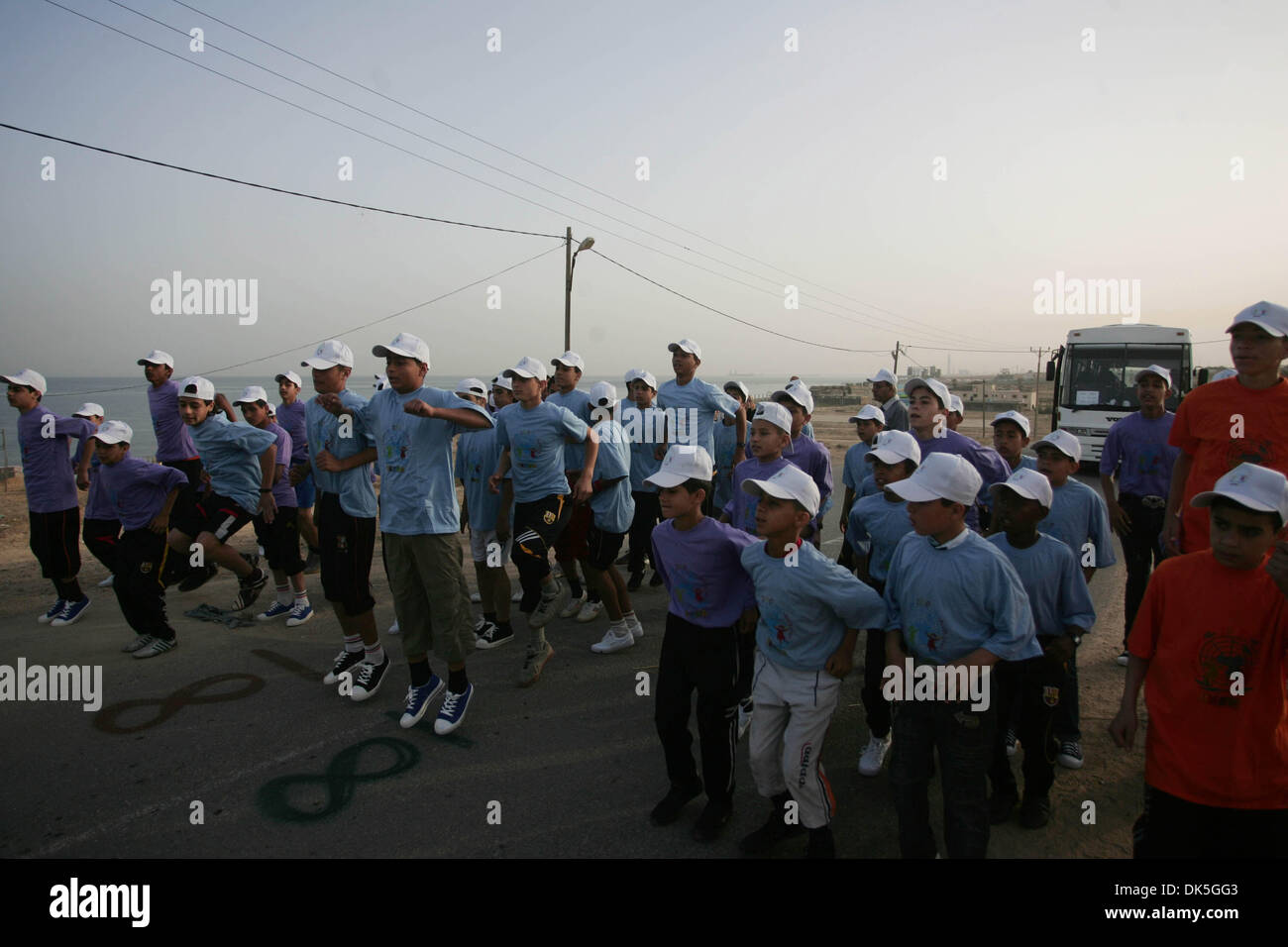 May 05, 2011 - Gaza city, Gaza Strip, Palestinian Territory - Palestinian schoolboys run in Beit Hanun as they compete in the Gaza Strip's first-ever marathon which runs the entire length of the coastal enclave.More than 1,000 runners participated Thursday in the Gaza Strip's first official marathon, a landmark recreational event in a territory far more accustomed to war and violen Stock Photo