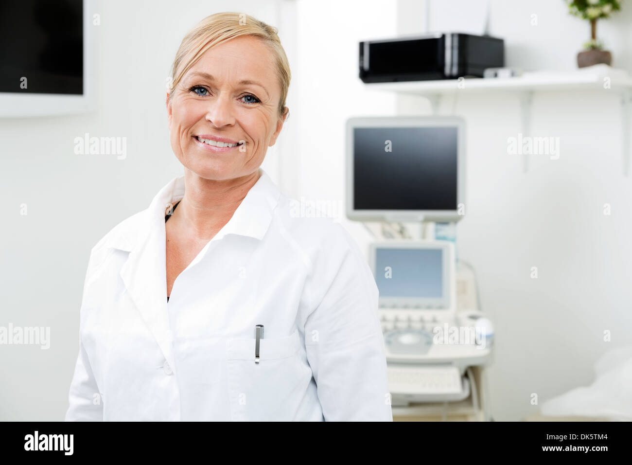 Smiling Gynecologist With Ultrasound Machine Stock Photo Alamy