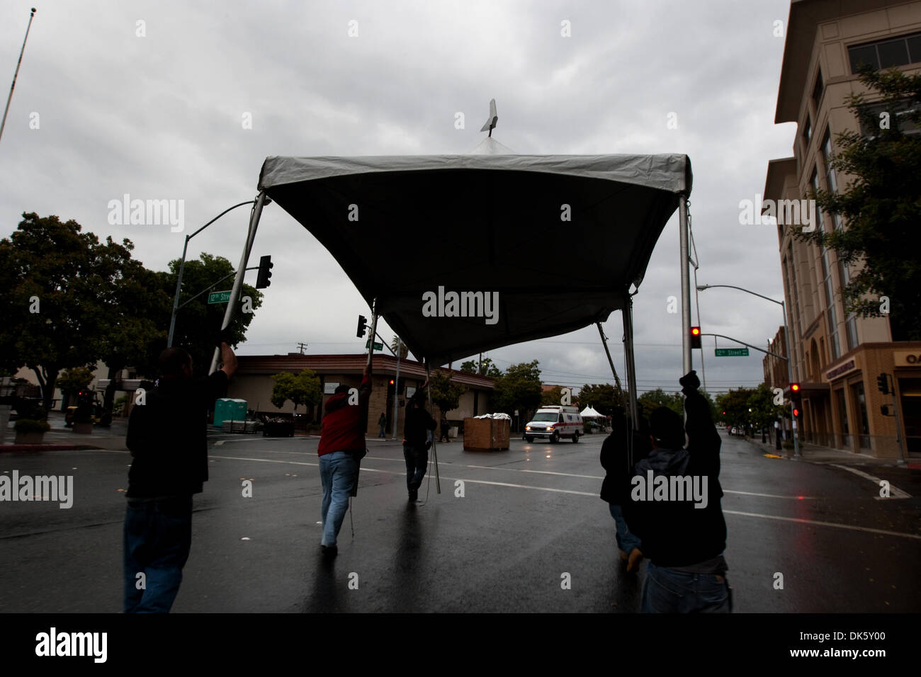 May 16, 2011 - Modesto, California, U.S. - (DARRYL BUSH/dbush@modbee.com) - Workers for Classic Party Rentals, carry a tent in preparation for the Amgen Tour of California cycling race on I Street, in downtown Modesto, Calif., on Monday, May 16, 2011. (Credit Image: © Darryl Bush/Modesto Bee/ZUMAPRESS.com) Stock Photo