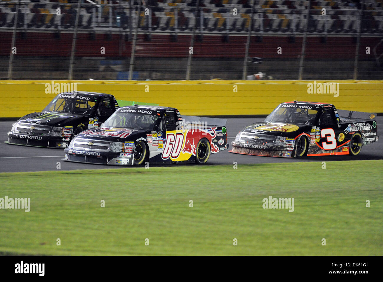 May 20, 2011 - Concord, North Carolina, U.S - Camping World Truck Series driver Cole Whitt (60) battles Camping World Truck Series driver Ricky Carmichael (4) and Camping World Truck Series driver Austin Dillon (3) for position on the front stretch during the North Carolina Education Lottery 200 at Charlotte Motor Speedway in Concord, NC. (Credit Image: © Michael Johnson/Southcreek Stock Photo